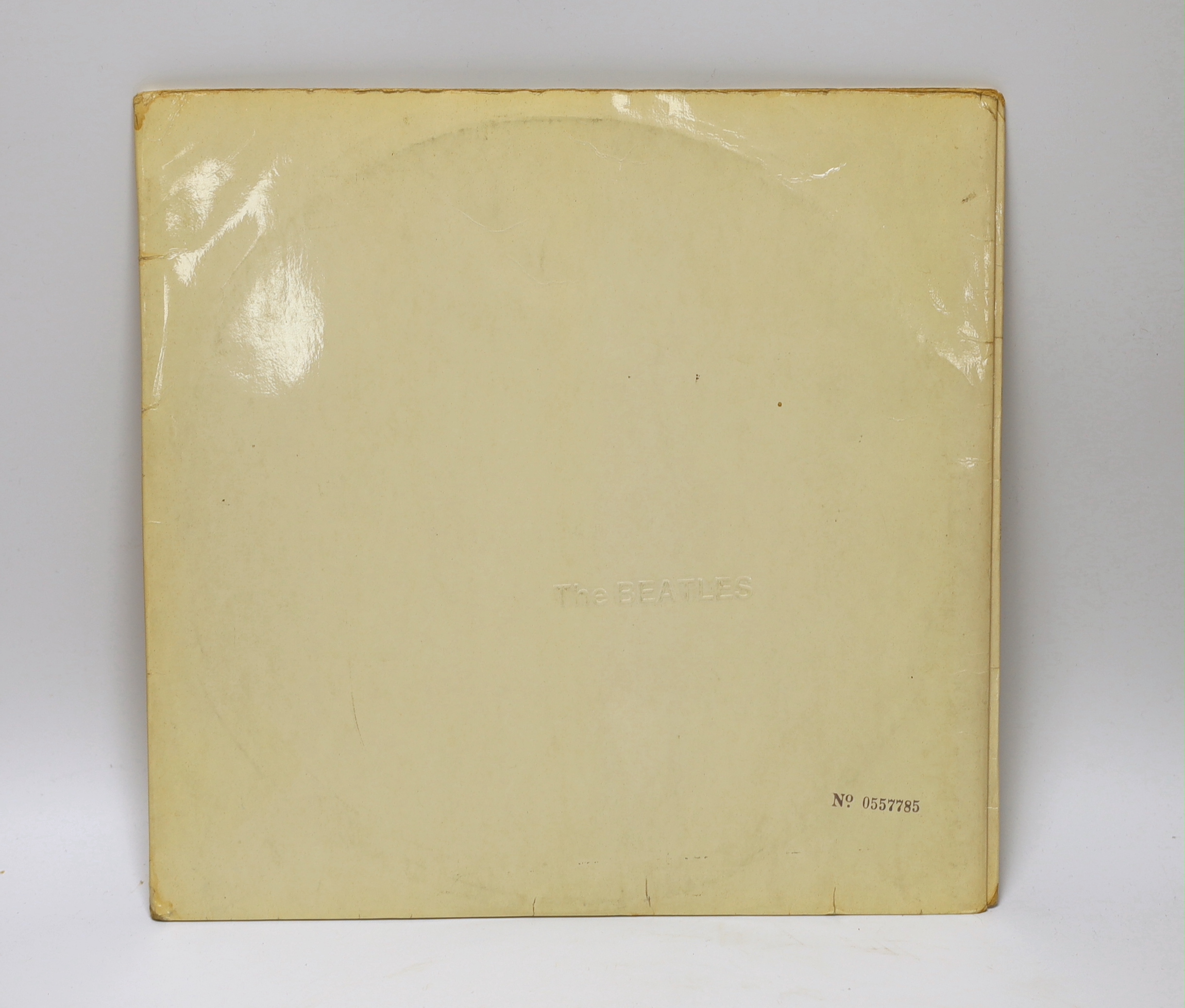 The Beatles; The White Album, top opening cover numbered 0557785, two LPs with set of four photographs and booklet, missing inner sleeves